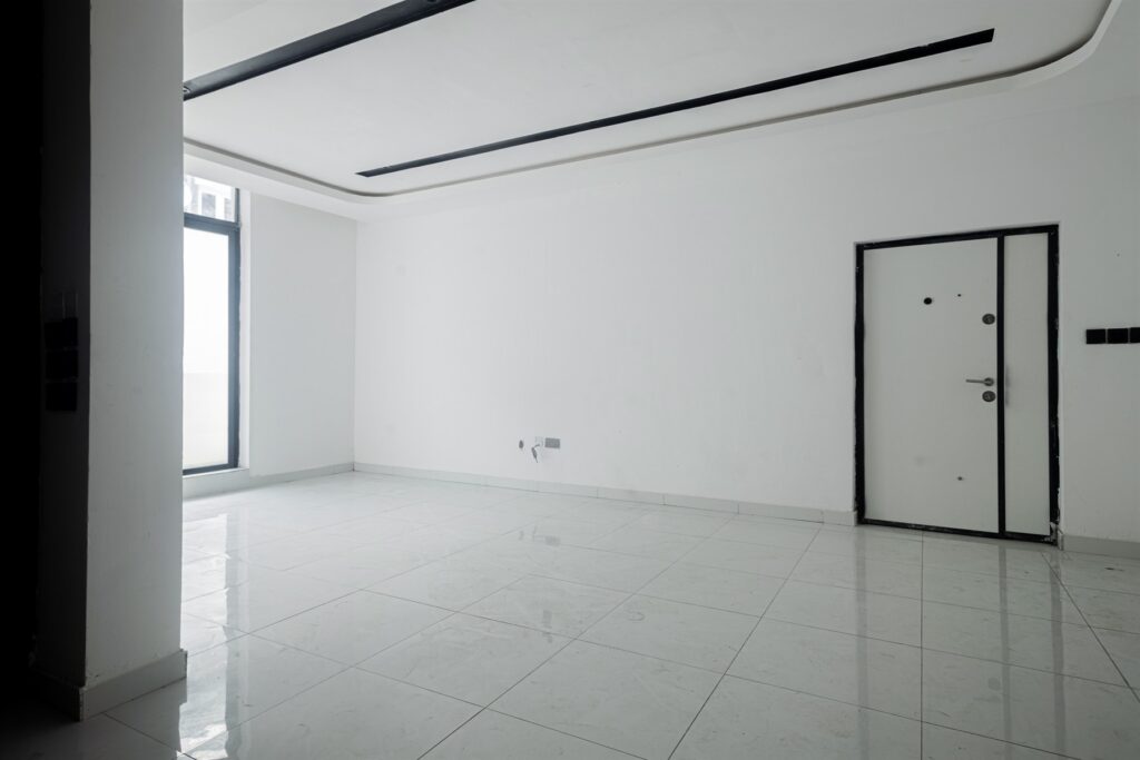 Brum Height 5: Unfurnished room with a recessed ceiling and tiled flooring